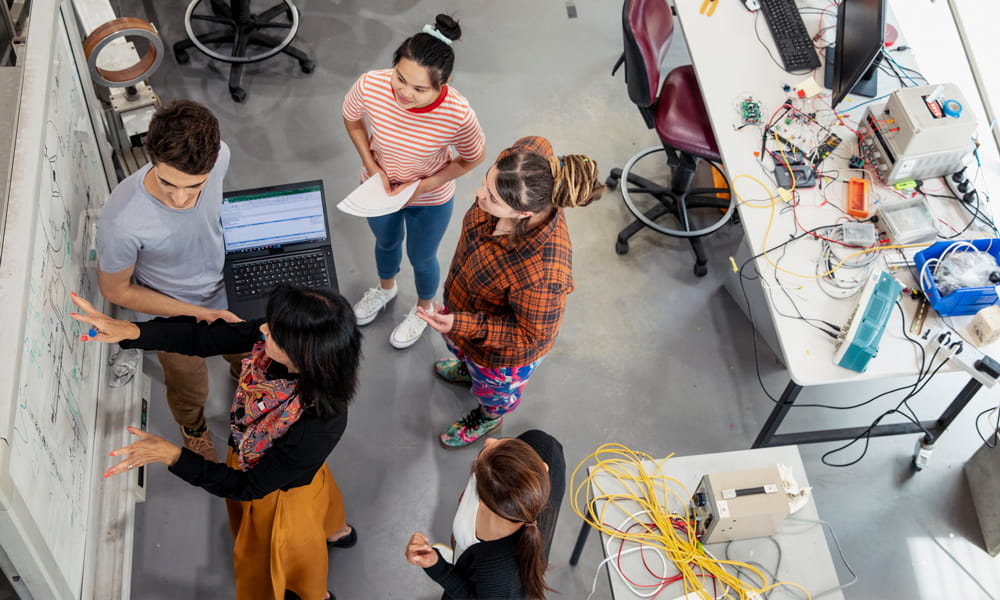 a group of people in a room on power management ic / intergrated circuits page